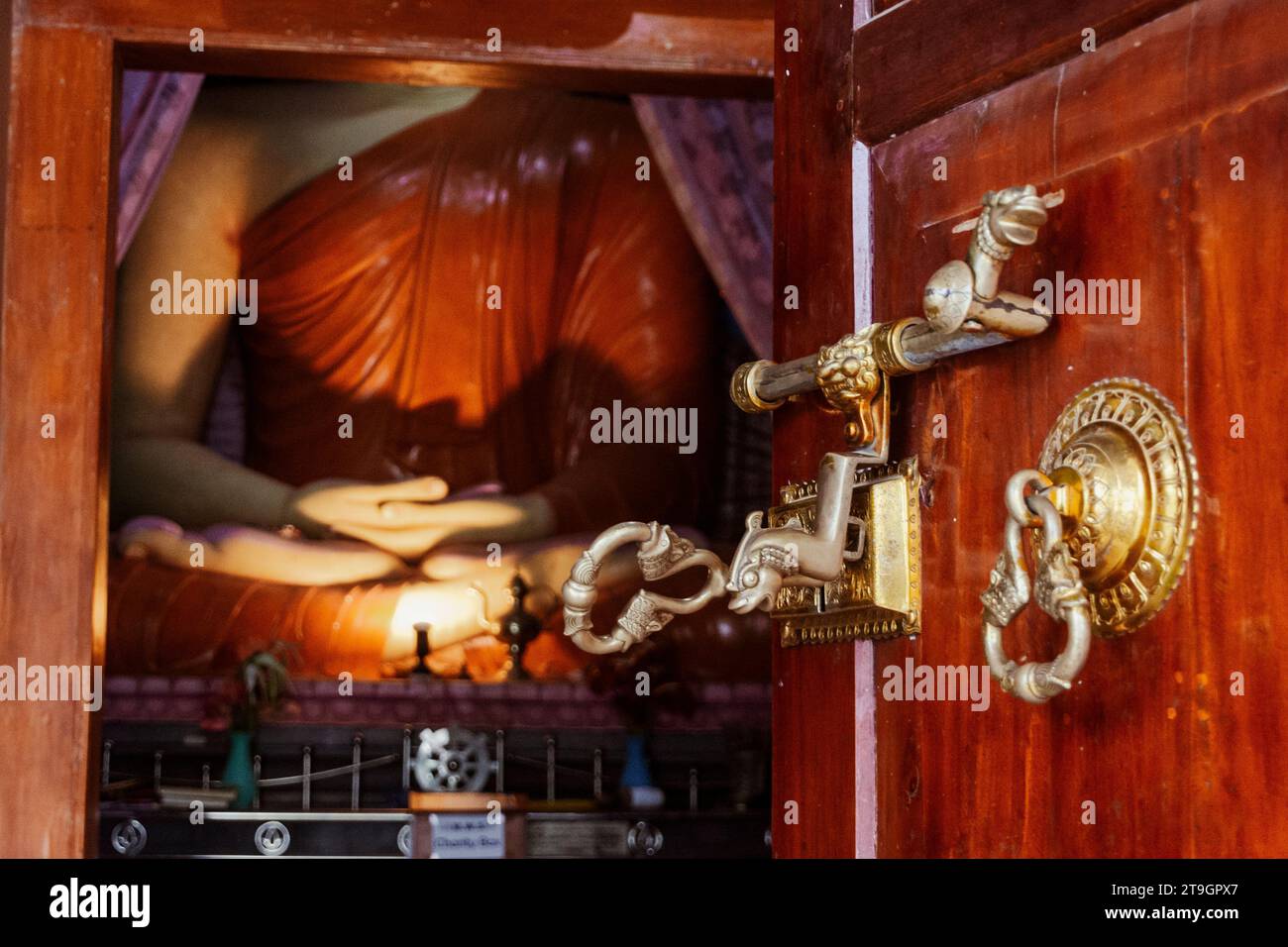 A very ornate door handle and lock into a buddhist temple near Ella in