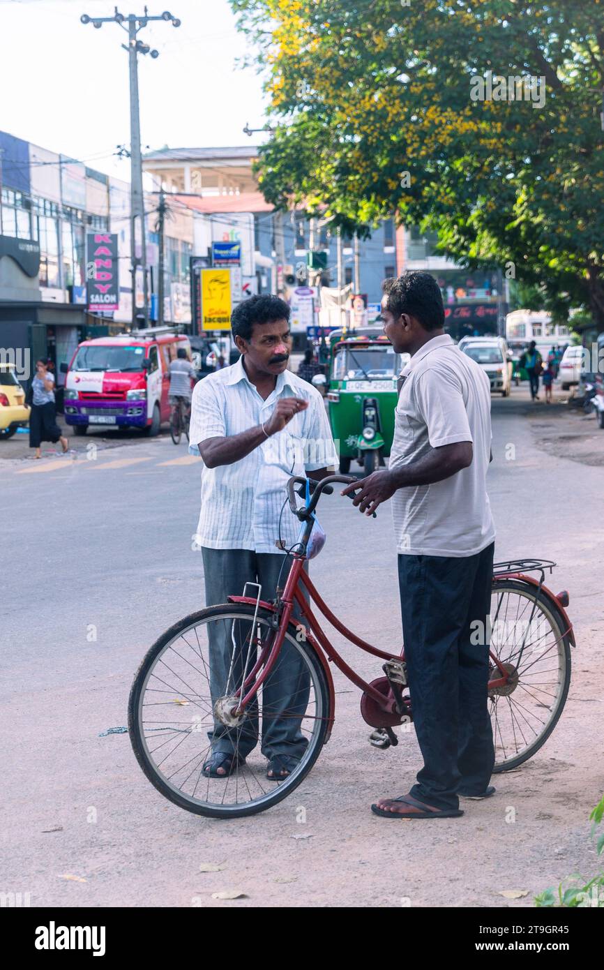 Two local men have a chat in the street in Negombo in Sri Lanka Stock Photo Alamy