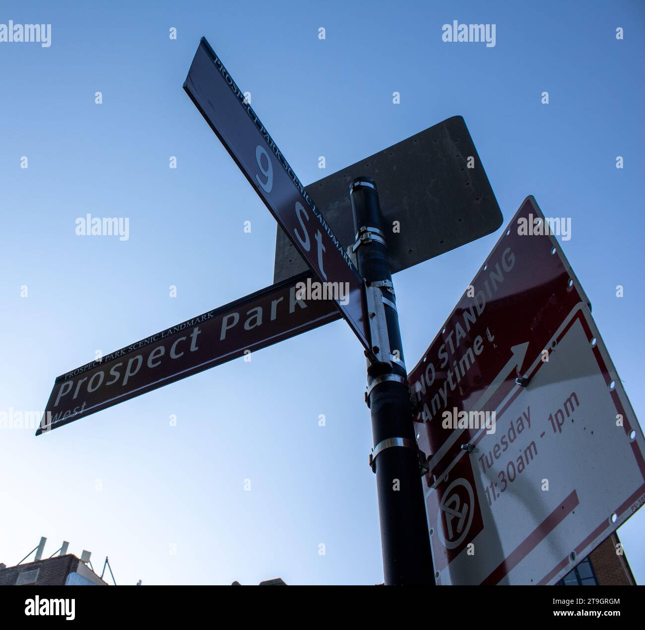 Direction street signs and parking sign in 9th street landmark on prospect park, brooklyn new