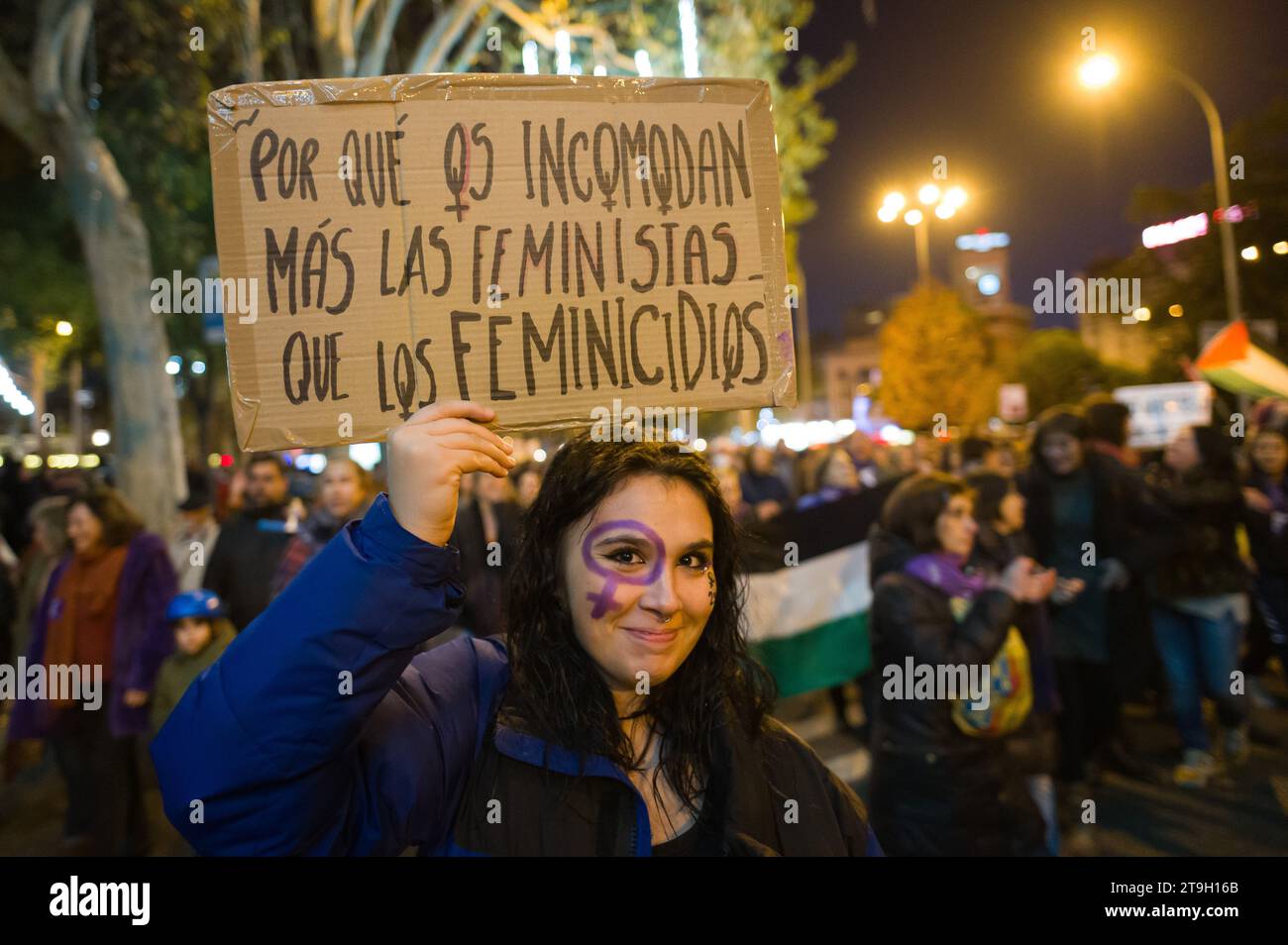Madrid, Spain. 25th Nov, 2023. A woman carrying a placard reading 'Why do feminists bother you more than femicides?' during a demonstration for the International Day for the Elimination of Violence against Women. Credit: Marcos del Mazo/Alamy Live News Stock Photo