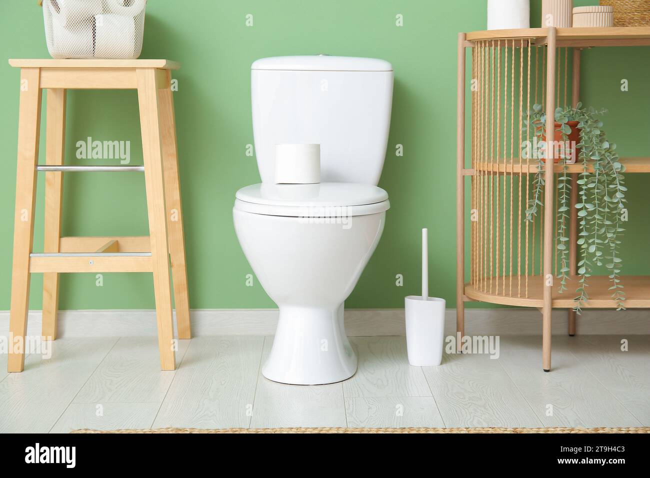 Stylish interior of restroom with ceramic toilet bowl Stock Photo - Alamy