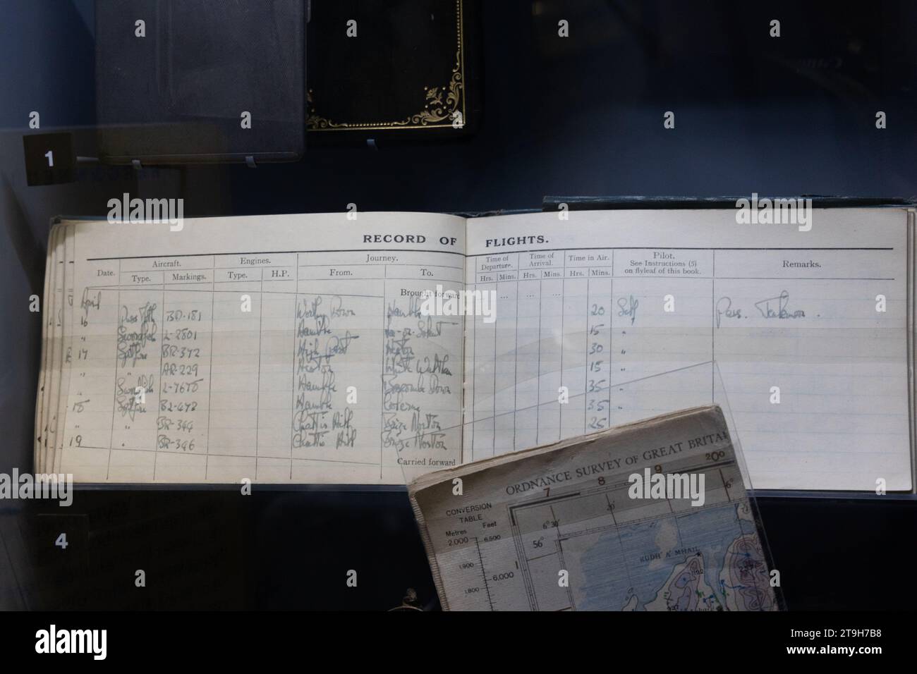 Hand written flight log book on display at Brooklands museum, Weybridge, Surrey, UK Stock Photo