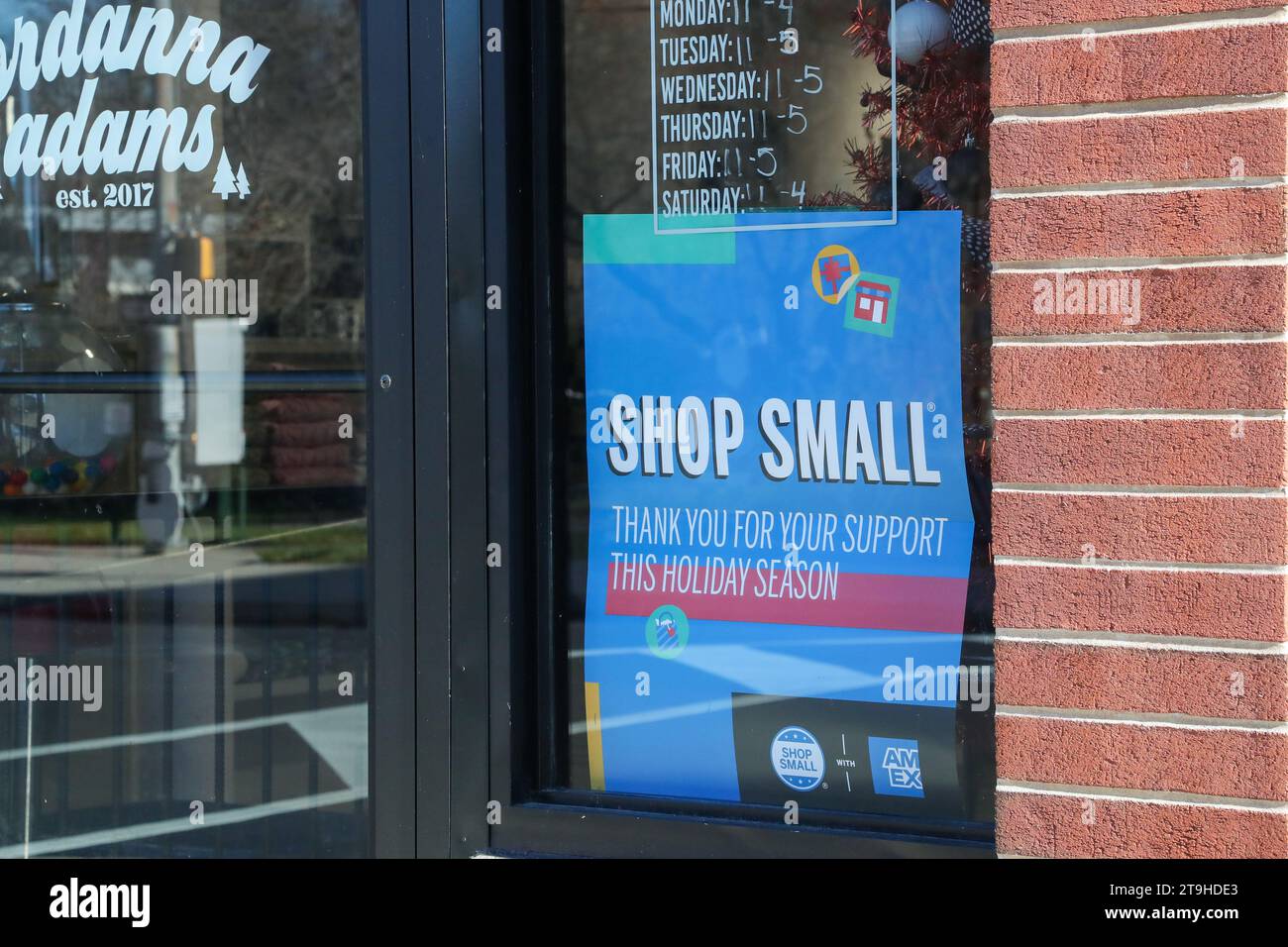 Milton, United States. 25th Nov, 2023. A Shop Small sign is seen in the window of the Jordanna Adams clothing store during the 14th annual Small Business Saturday on November 25, 2023 in Milton, Pennsylvania. (Photo by Paul Weaver/Sipa USA) Credit: Sipa USA/Alamy Live News Stock Photo