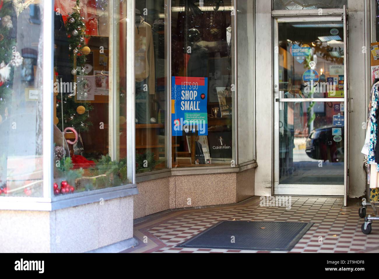 Danville, United States. 25th Nov, 2023. Shop Small signs are seen in the window of D's Clothier during the 14th annual Small Business Saturday on November 25, 2023 in Danville, Pennsylvania. (Photo by Paul Weaver/Sipa USA) Credit: Sipa USA/Alamy Live News Stock Photo