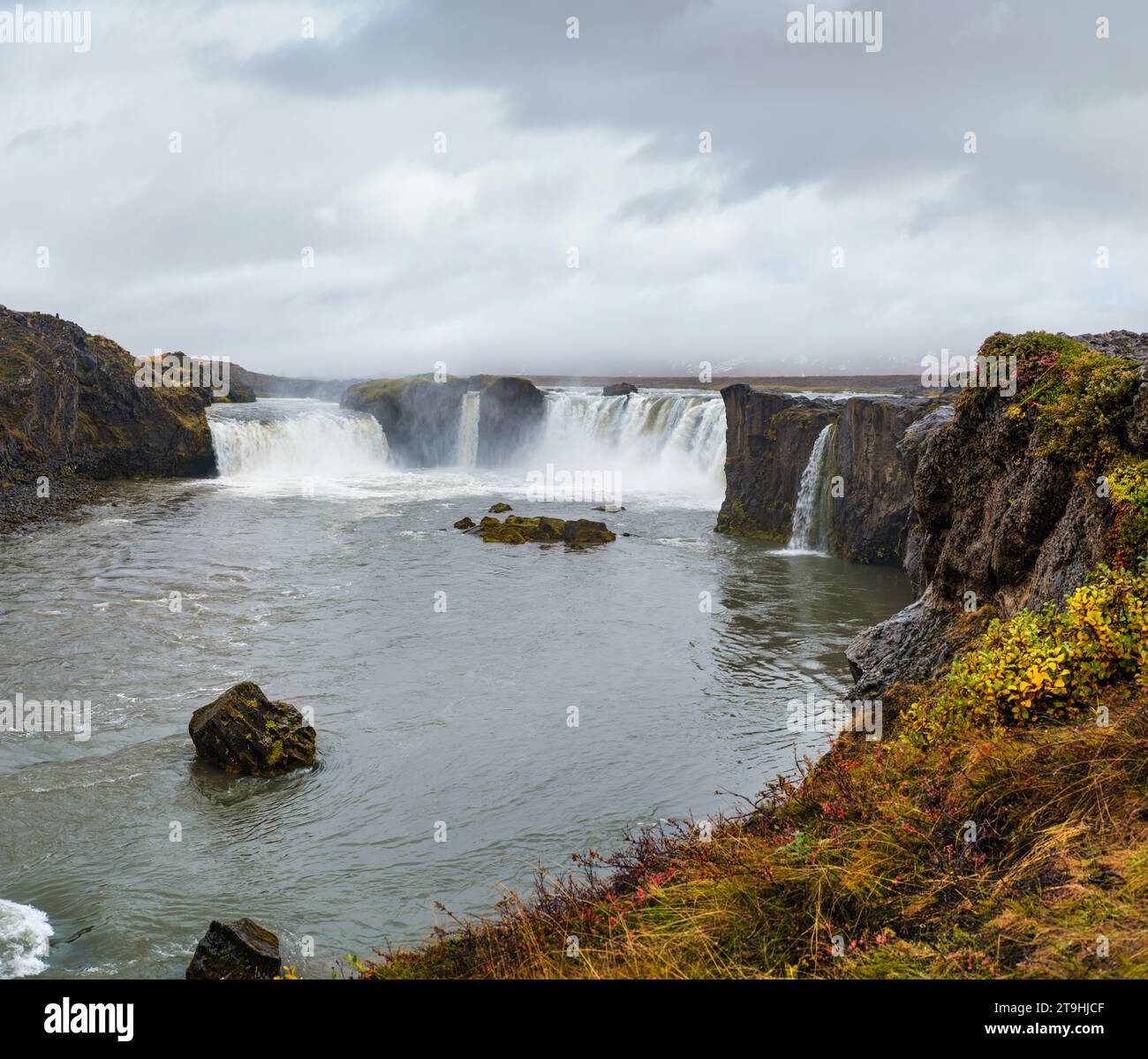 Picturesque full of water big waterfall Godafoss autumn dull day view, north Iceland. Stock Photo