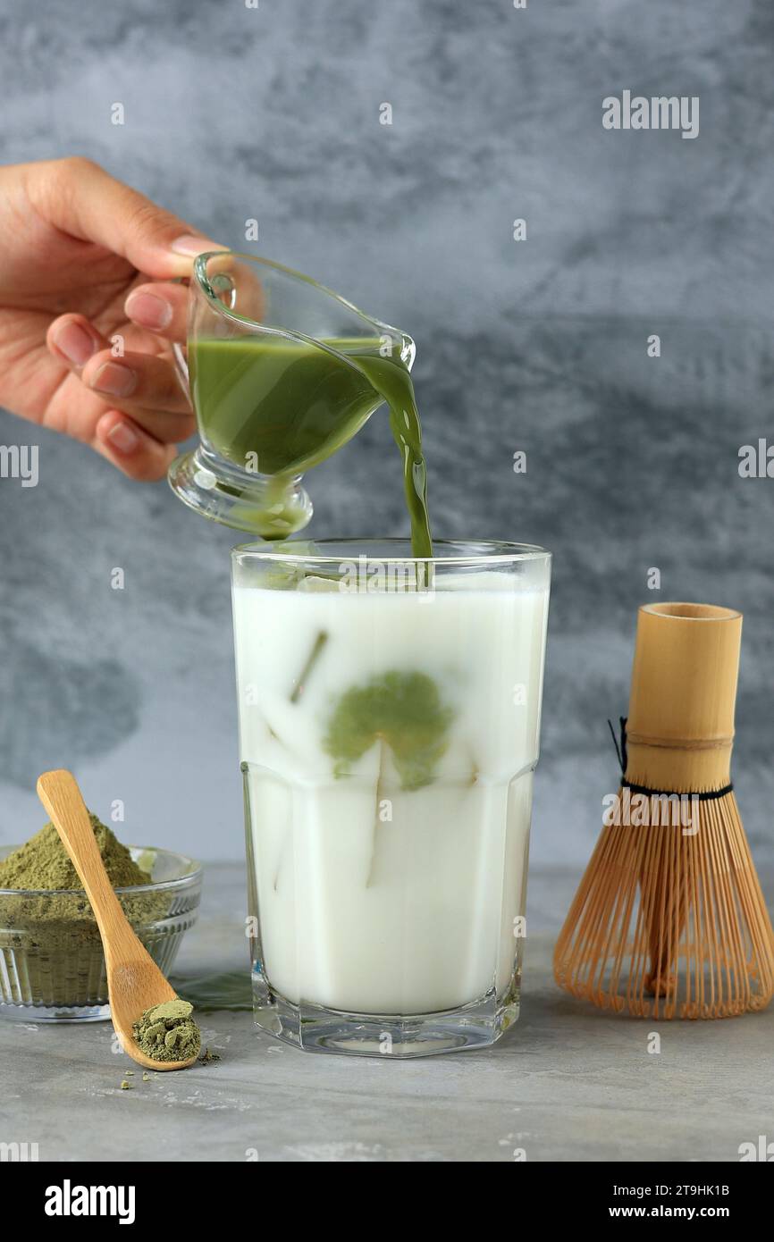 Pour Matcha to the Milk, Process Making Green Tea Latte Stock Photo