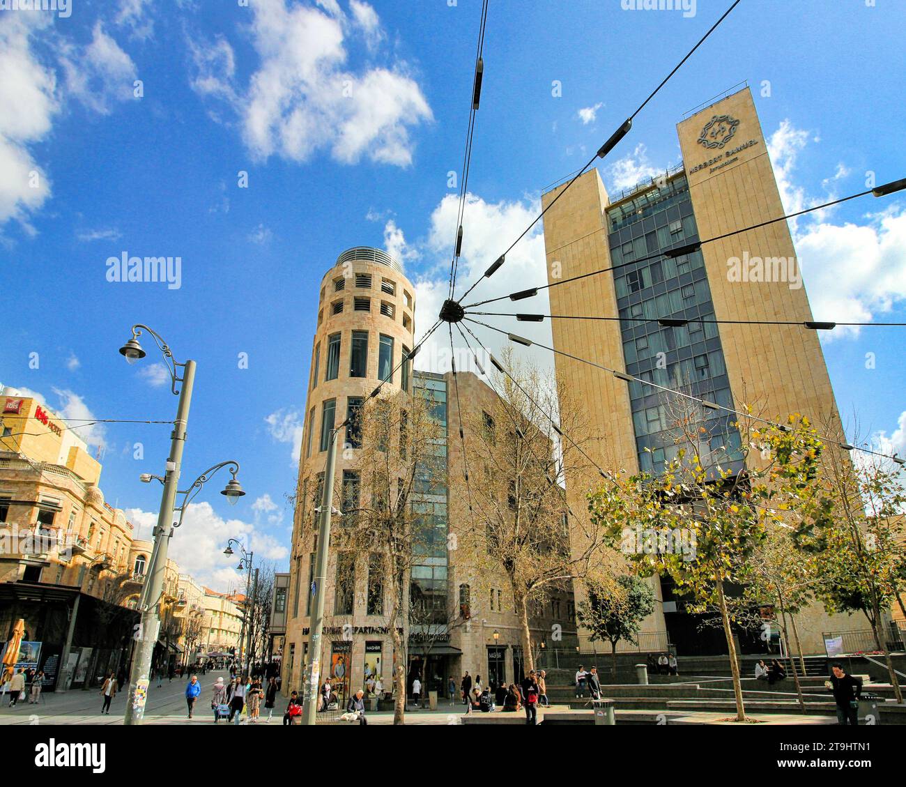 A wide-angle view of buildings, light rail, and electric grid at Zion Square on Jaffa Street and the Ben Yehuda pedestrian mall. Stock Photo