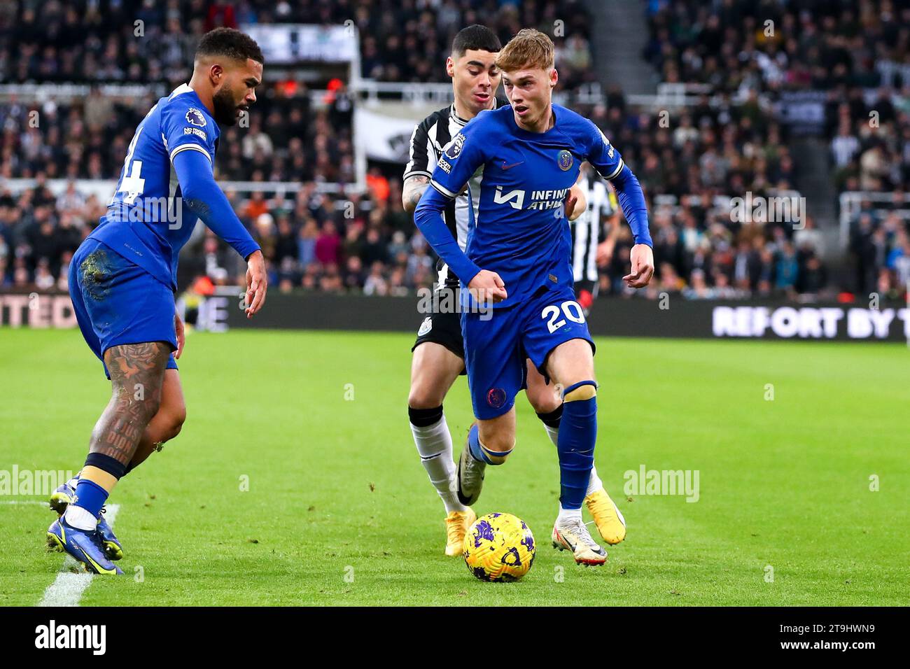 Newcastle, UK. 25th Nov, 2023. Cole Palmer #20 of Chelsea defends possession from Miguel Almir-n #24 of Newcastle United during the Premier League match Newcastle United vs Chelsea at St. James's Park, Newcastle, United Kingdom, 25th November 2023 (Photo by Ryan Crockett/News Images) Credit: News Images LTD/Alamy Live News Stock Photo