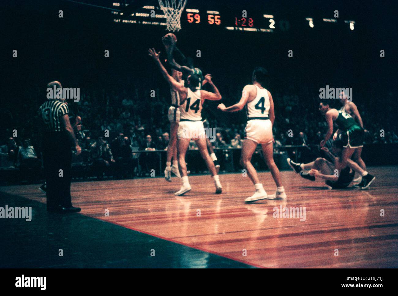 NEW YORK, NY - OCTOBER 25: Bill Russell #6 of the Boston Celtics grabs the rebound as Kenny Sears #12 and Charlie Tyra #14 of the New York Knicks defend during an NBA game on October 25, 1958 at the Madison Square Garden in New York, New York.  (Photo by Hy Peskin) *** Local Caption *** Bill Russell;Kenny Sears;Charlie Tyra Stock Photo