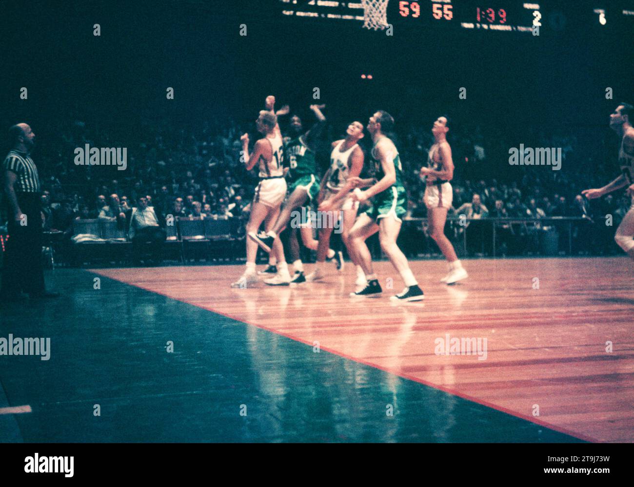 NEW YORK, NY - OCTOBER 25: Bill Russell #6 of the Boston Celtics shoots as Kenny Sears #12 and Charlie Tyra #14 of the New York Knicks defend during an NBA game on October 25, 1958 at the Madison Square Garden in New York, New York.  (Photo by Hy Peskin) *** Local Caption *** Bill Russell;Kenny Sears;Charlie Tyra Stock Photo
