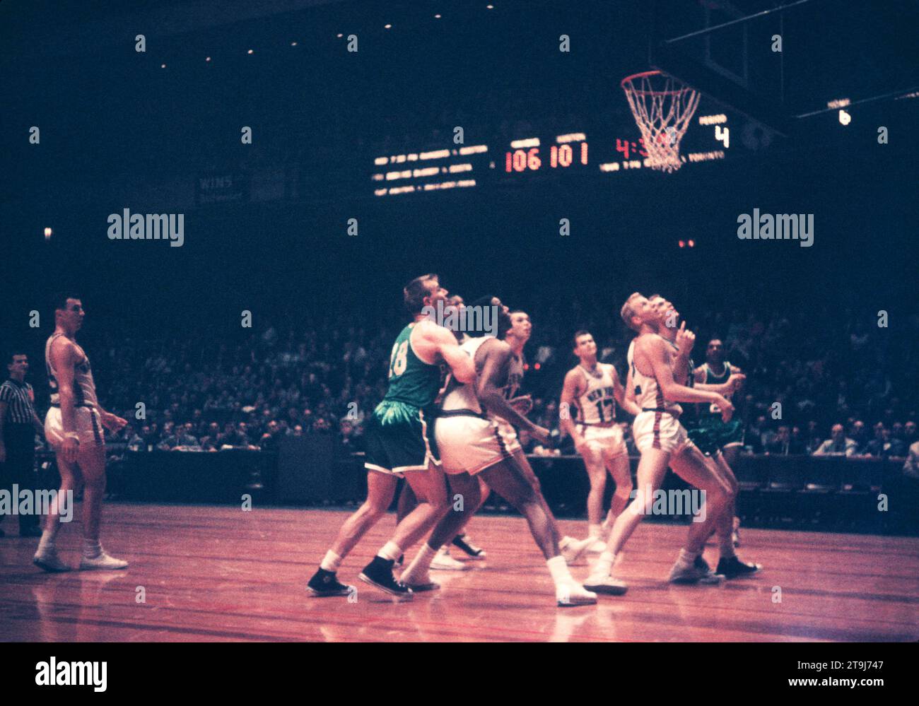 NEW YORK, NY - OCTOBER 25: Jim Loscutoff #18 of the Boston Celtics, Willie Naulls #6 and Kenny Sears #12 of the New York Knicks wait for the rebound during an NBA game on October 25, 1958 at the Madison Square Garden in New York, New York.  (Photo by Hy Peskin) *** Local Caption *** Jim Loscutoff;Willie Naulls;Kenny Sears Stock Photo