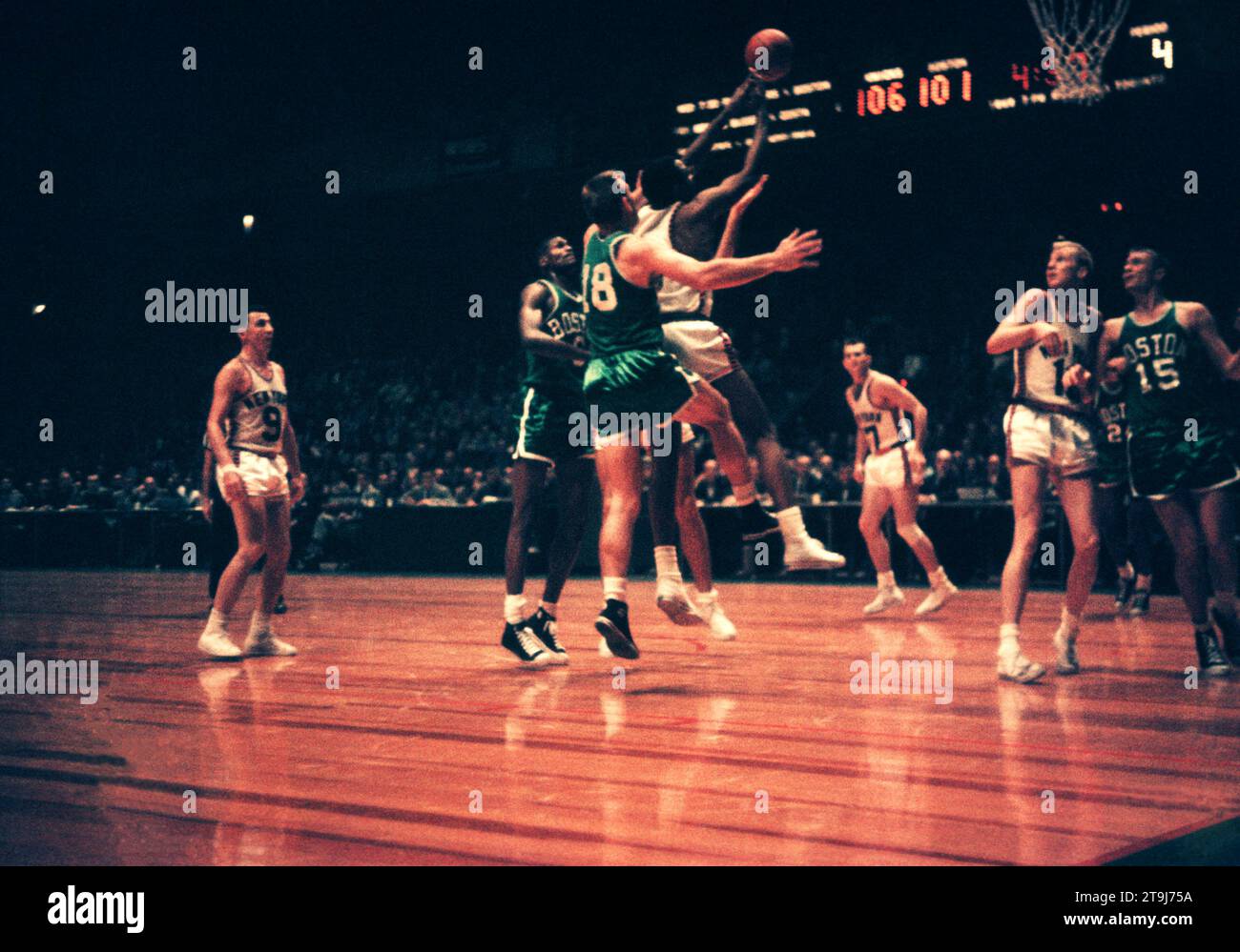 NEW YORK, NY - OCTOBER 25: Willie Naulls #6 of the New York Knicks grabs the rebound in front of Jim Loscutoff #18 of the Boston Celtics during an NBA game on October 25, 1958 at the Madison Square Garden in New York, New York.  (Photo by Hy Peskin) *** Local Caption *** Willie Naulls;Jim Loscutoff Stock Photo