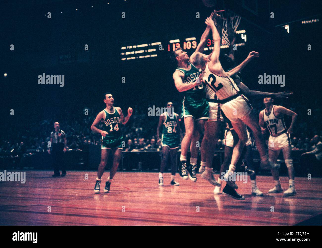 NEW YORK, NY - OCTOBER 25: Jim Loscutoff #18, Bill Russell #6 of the Boston Celtics and Kenny Sears #12 of the New York Knicks go go for the rebound during an NBA game on October 25, 1958 at the Madison Square Garden in New York, New York.  (Photo by Hy Peskin) *** Local Caption *** Jim Loscutoff;Kenny Sears;Bill Russell Stock Photo