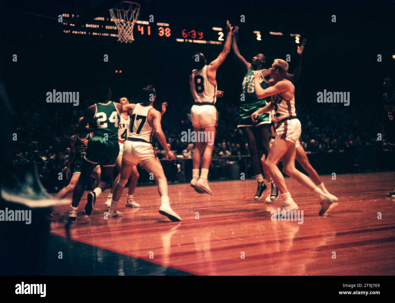 NEW YORK, NY - OCTOBER 25:  Mike Farmer #8 of the New York Knicks and Bennie Swain #16 of the Boston Celtics fight for the rebound during an NBA game on October 25, 1958 at the Madison Square Garden in New York, New York.  (Photo by Hy Peskin) *** Local Caption *** Mike Farmer;Bennie Swain Stock Photo
