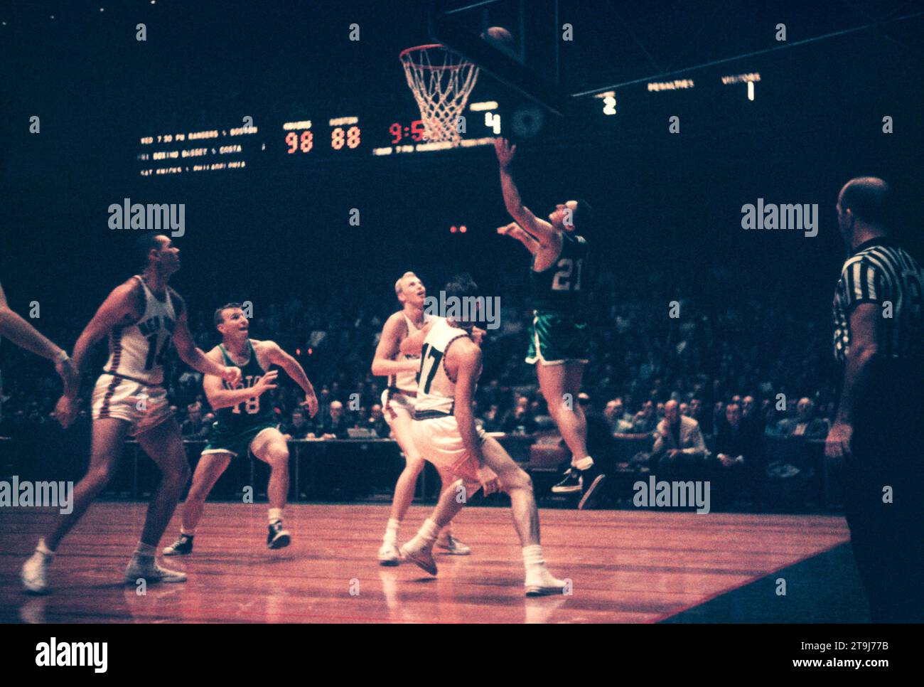 NEW YORK, NY - OCTOBER 25: Bill Sharman #21 of the Boston Celtics goes for the lay-up as Ron Sobie #17 of the New York Knicks defends during an NBA game on October 25, 1958 at the Madison Square Garden in New York, New York.  (Photo by Hy Peskin) *** Local Caption *** Bill Sharman;Ron Sobie Stock Photo