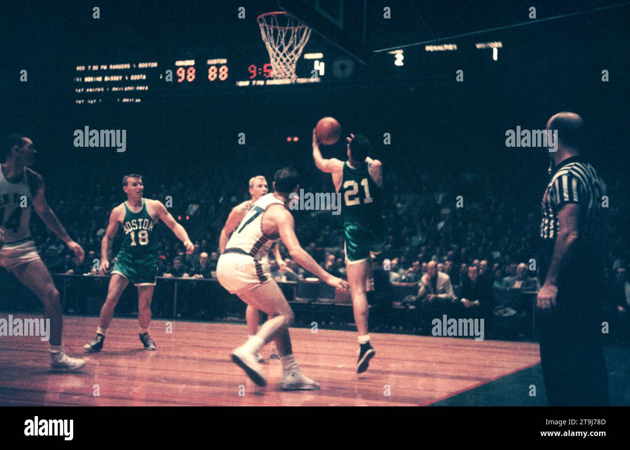 NEW YORK, NY - OCTOBER 25: Bill Sharman #21 of the Boston Celtics goes for the lay-up as Ron Sobie #17 of the New York Knicks defends during an NBA game on October 25, 1958 at the Madison Square Garden in New York, New York.  (Photo by Hy Peskin) *** Local Caption *** Bill Sharman;Ron Sobie Stock Photo