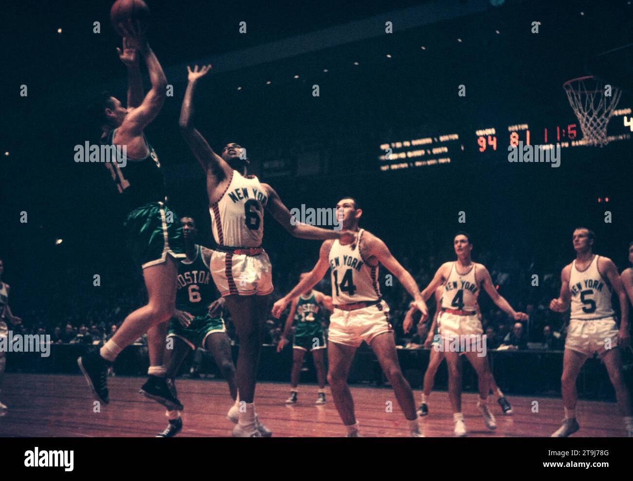 NEW YORK, NY - OCTOBER 25: Bill Sharman #21 of the Boston Celtics shoots as Willie Naulls #6 of the New York Knicks defends during an NBA game on October 25, 1958 at the Madison Square Garden in New York, New York.  (Photo by Hy Peskin) *** Local Caption *** Bill Sharman;Willie Naulls Stock Photo