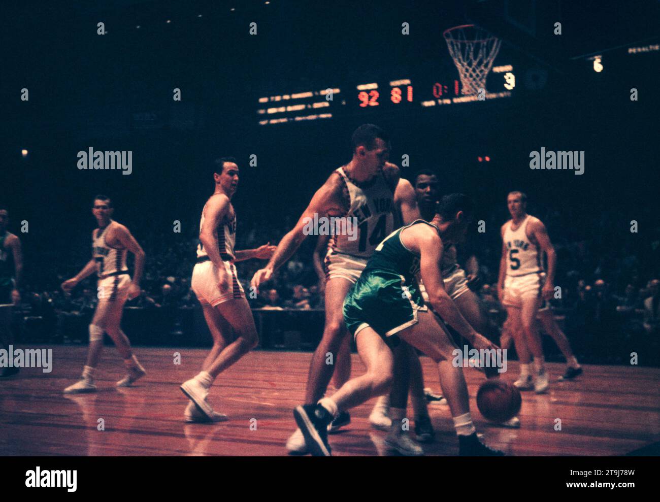 NEW YORK, NY - OCTOBER 25: Bill Sharman #21 of the Boston Celtics dribbles around Charlie Tyra #14 of the New York Knicks during an NBA game on October 25, 1958 at the Madison Square Garden in New York, New York.  (Photo by Hy Peskin) *** Local Caption *** Bill Sharman;Charlie Tyra Stock Photo
