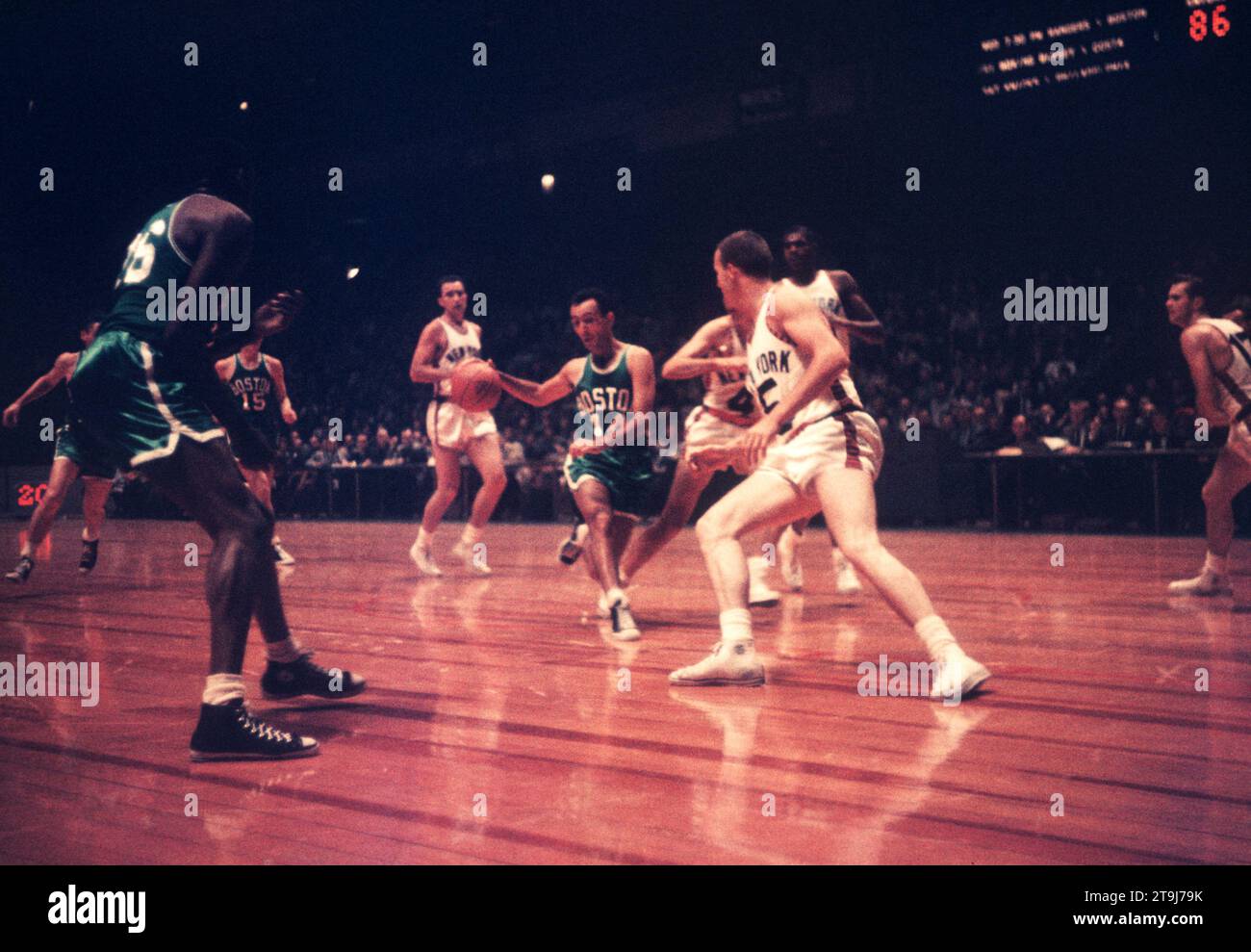NEW YORK, NY - OCTOBER 25: Bob Cousy #14 of the Boston Celtics dribbles as Frank Selvy #15 of the New York Knicks defends during an NBA game on October 25, 1958 at the Madison Square Garden in New York, New York.  (Photo by Hy Peskin) *** Local Caption *** Bob Cousy;Frank Selvy Stock Photo
