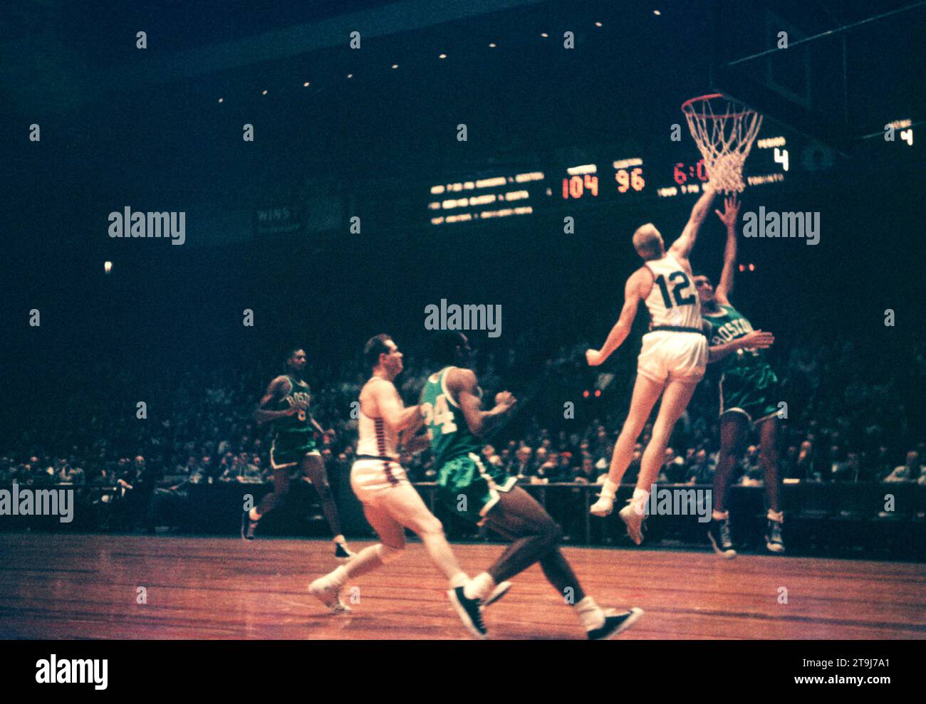 NEW YORK, NY - OCTOBER 25: Bob Cousy #14 of the Boston Celtics shoots over Kenny Sears #12 of the New York Knicks during an NBA game on October 25, 1958 at the Madison Square Garden in New York, New York.  (Photo by Hy Peskin) *** Local Caption *** Bob Cousy;Kenny Sears Stock Photo