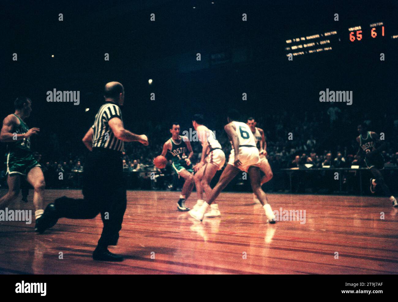 NEW YORK, NY - OCTOBER 25: Bob Cousy #14 of the Boston Celtics dribbles during an NBA game against the New York Knicks on October 25, 1958 at the Madison Square Garden in New York, New York.  (Photo by Hy Peskin) *** Local Caption *** Bob Cousy Stock Photo