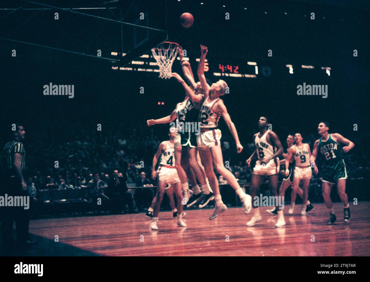 NEW YORK, NY - OCTOBER 25: Bob Cousy #14 of the Boston Celtics shoots as Kenny Sears #12 of the New York Knicks goes for the block during an NBA game on October 25, 1958 at the Madison Square Garden in New York, New York.  (Photo by Hy Peskin) *** Local Caption *** Bob Cousy;Kenny Sears Stock Photo