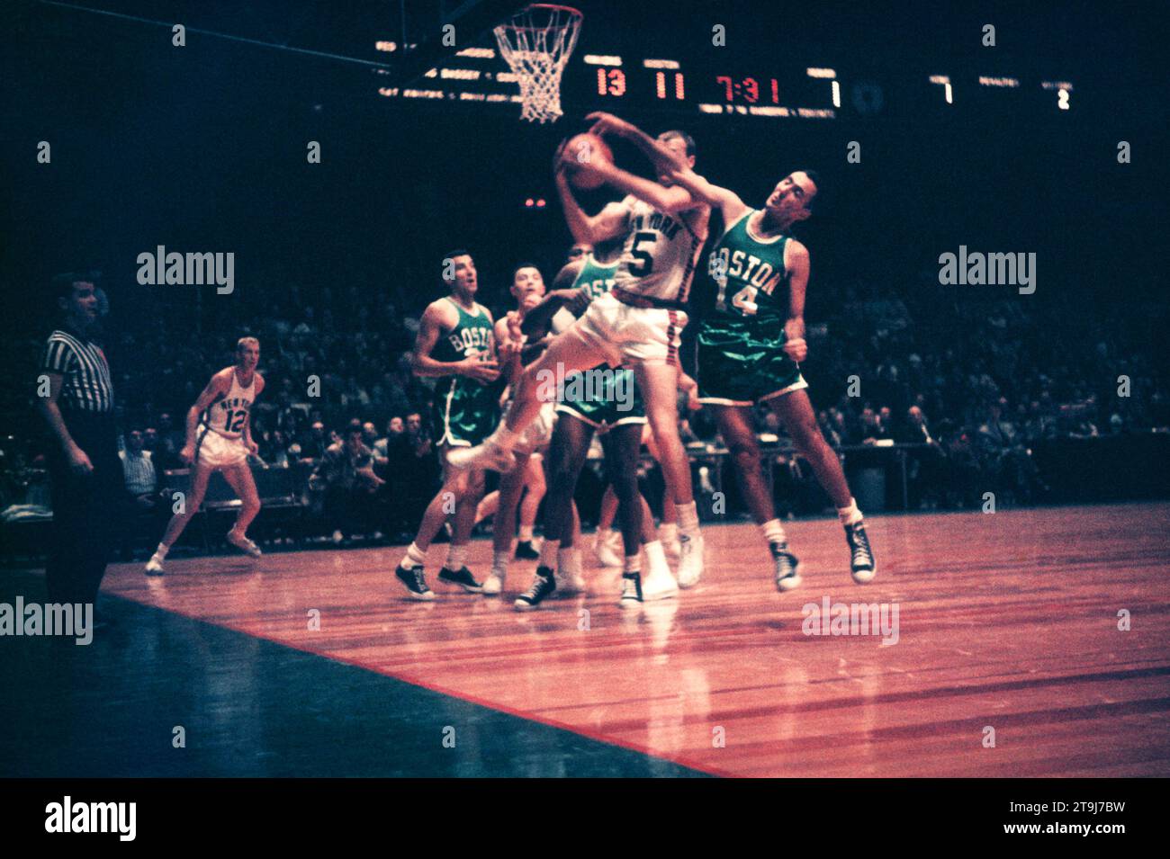 NEW YORK, NY - OCTOBER 25: Guy Sparrow #5 of the New York Knicks grabs the rebound from Bob Cousy #14 of the Boston Celtics during an NBA game on October 25, 1958 at the Madison Square Garden in New York, New York.  (Photo by Hy Peskin) *** Local Caption *** Bob Cousy;Guy Sparrow Stock Photo