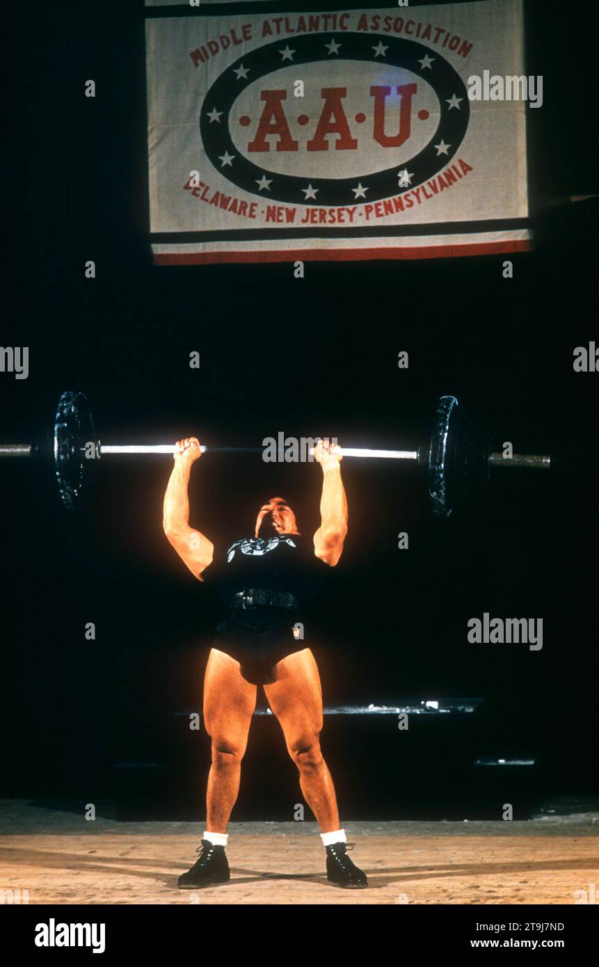 PHILADELPHIA, PA - JUNE, 1956: Weightlifter Tommy Kono (1930-2016) of the United States lifts the barbell during the A.A.U. Olympic tryouts circa June, 1956 in Philadelphia, Pennsylvania. (Photo by Hy Peskin) *** Local Caption *** Tommy Kono Stock Photo