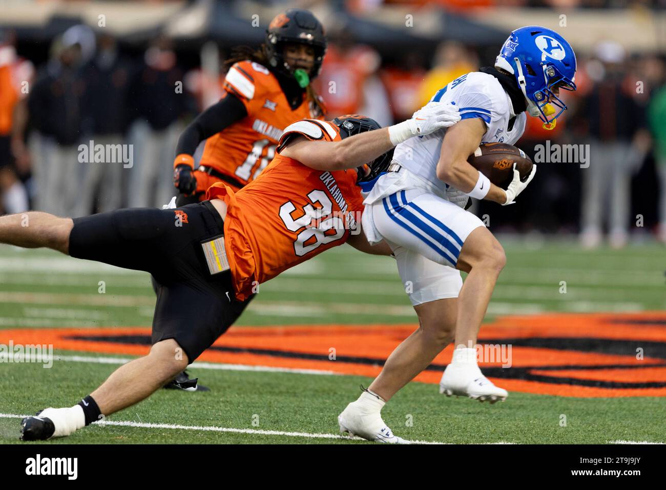 Oklahoma State safety Kade Welcher (38) tackles BYU wide receiver