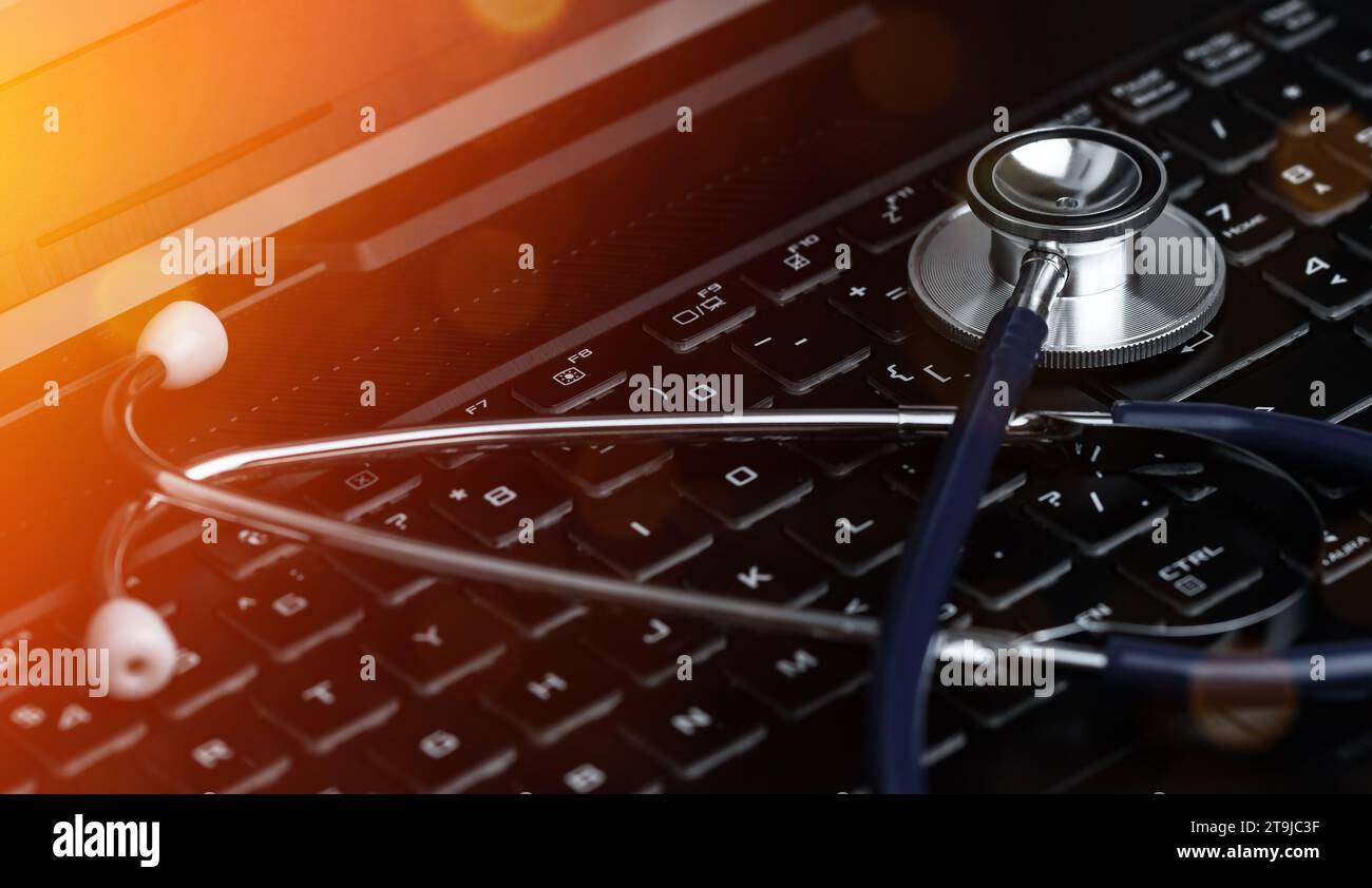 Stethoscope on a Laptop Keyboard. Global Medical Technology Diagnostic Concept. Stock Photo