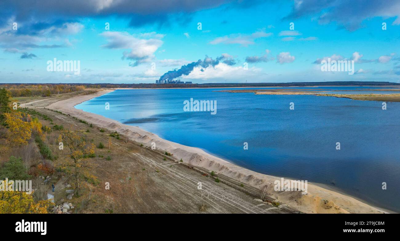 24 November 2023, Brandenburg, Cottbus: View over the newly created Cottbus Baltic Sea (aerial view with a drone). According to the operator Leag, the Cottbus Baltic Sea has reached a new filling record during its flooding. Currently, 3.8 cubic meters of water per second are flowing from the Spree into the lake, which is set to become the largest artificial body of water in Germany. The lake has now reached a maximum water level of 58.7 meters above sea level. The Baltic Sea, a former open-cast mining pit, will one day have a water surface area of almost 19 square kilometers. (to dpa 'Cottbuse Stock Photo