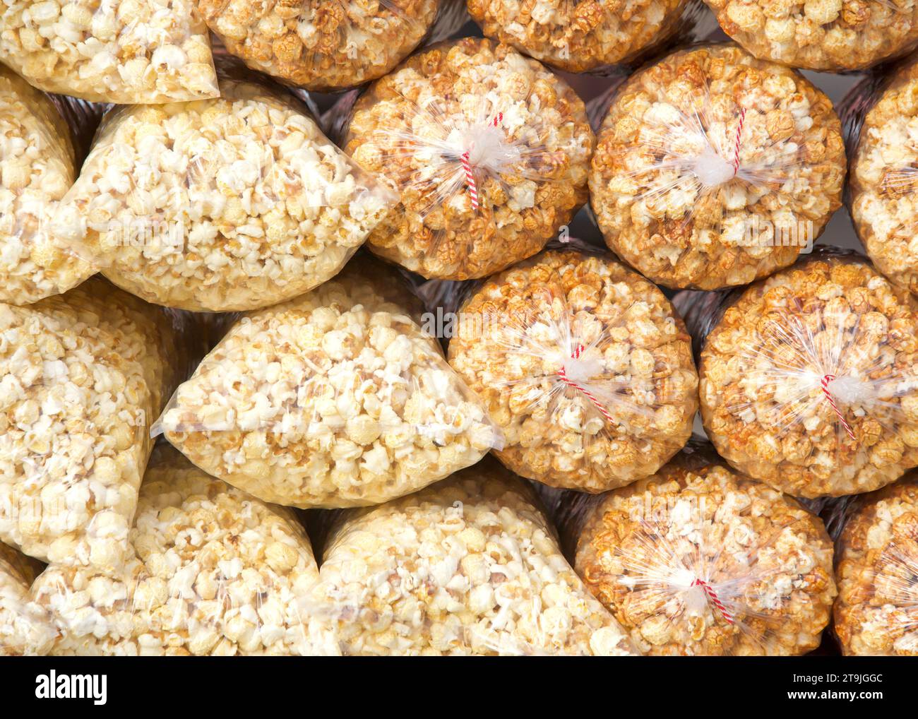 Bags of Kettle Corn piled up for sale, regular and cheese flavored in
