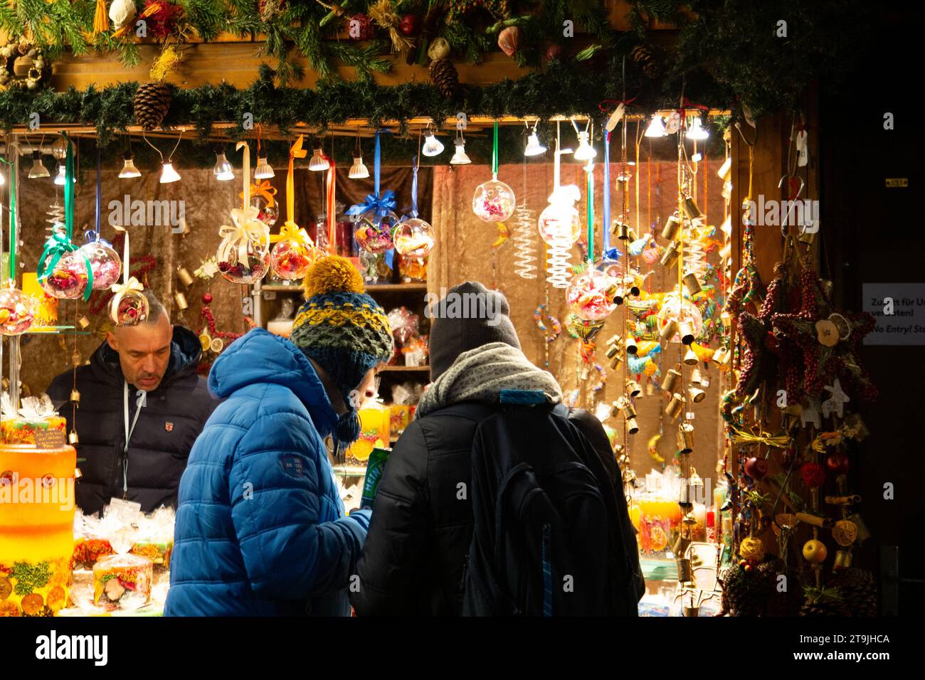 Street vendor outlets selling Christmas decorations and crowded