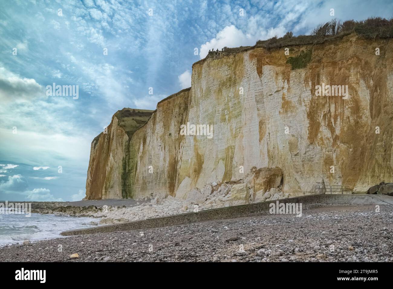 Etretat in Normandy, the famous cliffs and needle on the pebble beach ...