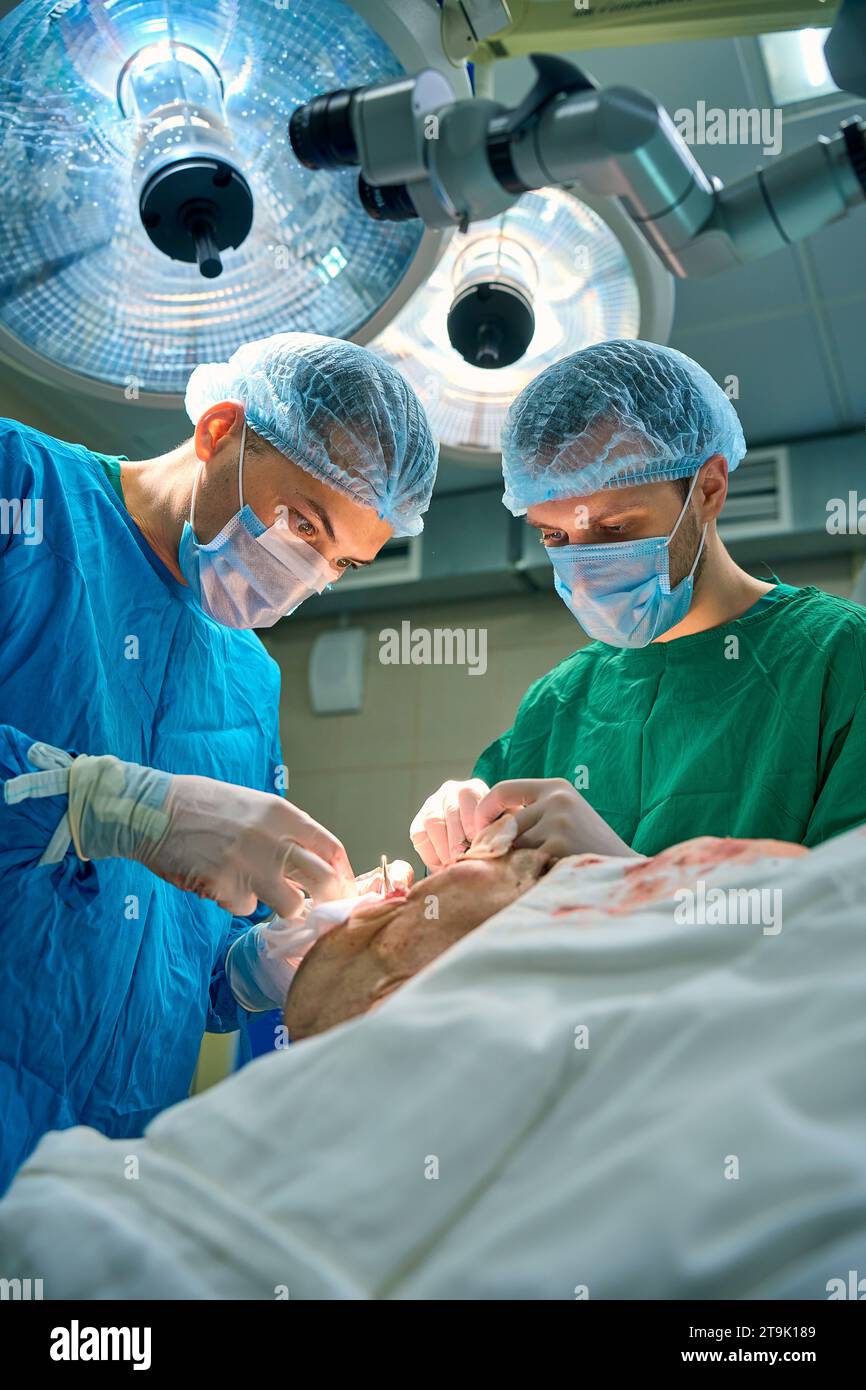 surgeries perform a heavy operation Stock Photo - Alamy