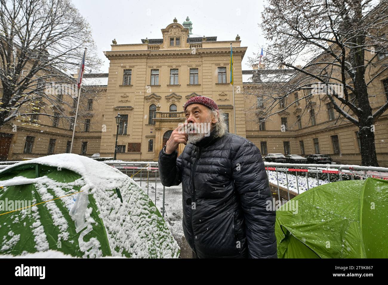 Activist and former dissident John Bok at the tents in front of the Czech Government Office, where he and former dissident Jiri Gruntorad are on hunger strike to protest against low pensions for dissidents, in Prague, Czech Republic, on Sunday, November 26, 2023. Gruntorad and Bok are expected to end their protest on Sunday, but they will wait until they receive a government decision signed by the prime minister, by which the cabinet on Saturday revoked its resolution declaring its adherence to the traditions of Charter 77 last January. The repeal of the resolution was a condition for ending t Stock Photo