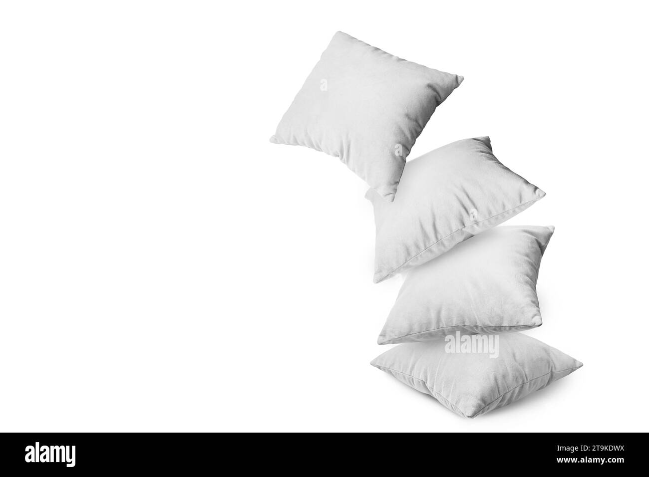 Stack of white pillows isolated on white background. Pile of  decorative cushions for sleeping and resting, home interior, house decor. Stock Photo