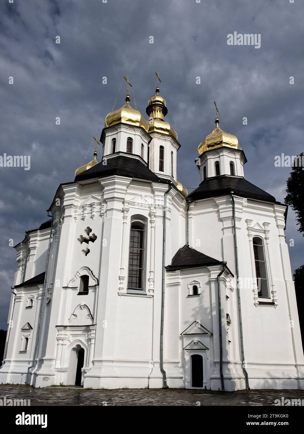 The Ukrainian Baroque architecture of Catherine's Church in Chernihiv comes to life in this image, with the magnificent white church featuring five ma Stock Photo