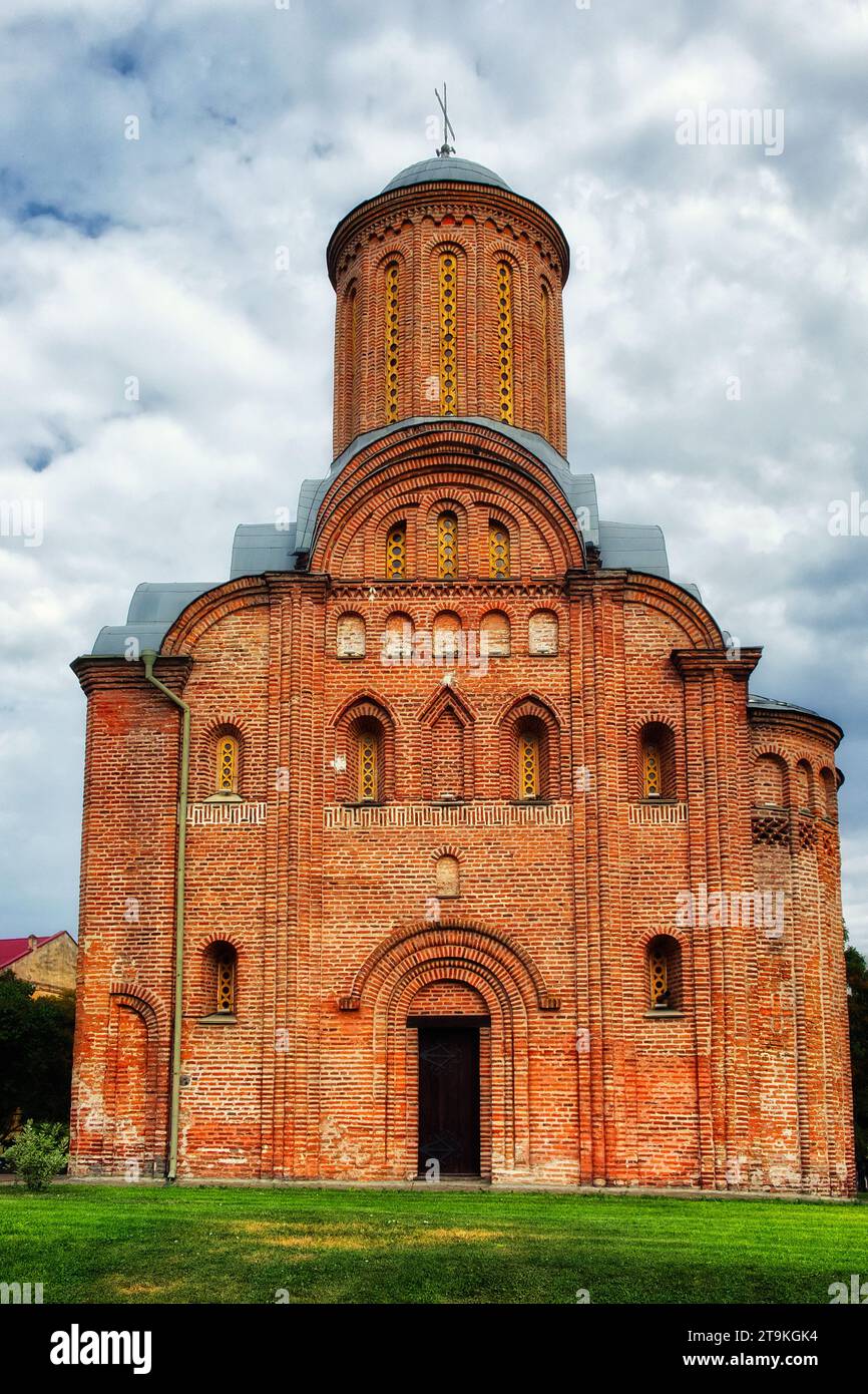 Nature frames the Pyatnitskaya Church beautifully in this scene, with its red brick facade, prominent dome, and cross, a clear and open sky, a medieva Stock Photo