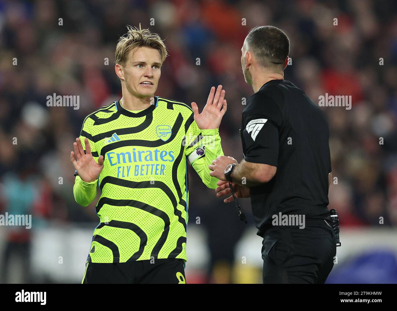 London, UK. 25th Nov, 2023. Martin Odegaard of Arsenal talks with Referee Tim Robinson during the Premier League match at Gtech Community Stadium, London. Picture credit should read: Paul Terry/Sportimage Credit: Sportimage Ltd/Alamy Live News Stock Photo