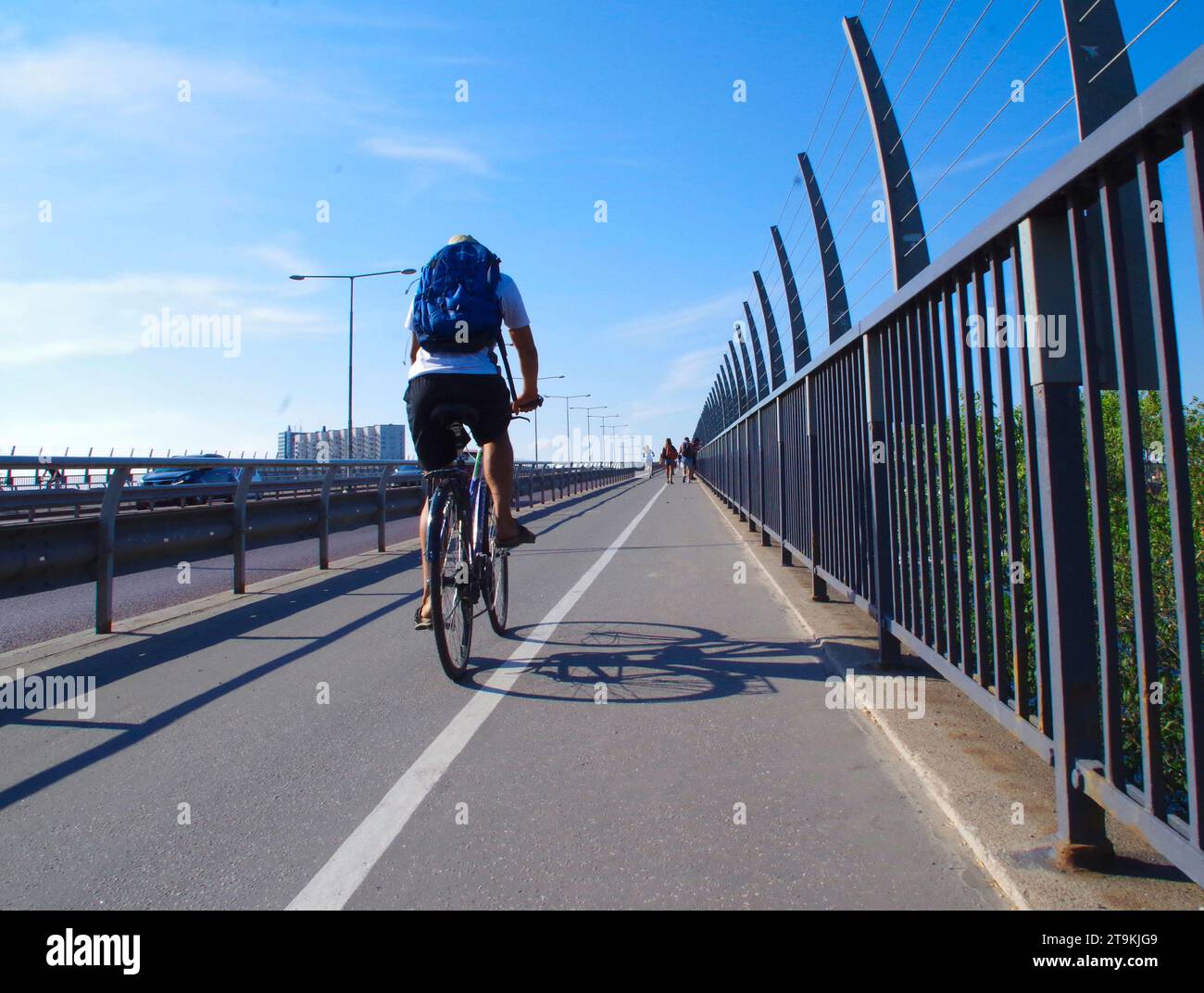 Bicycling along road in summertime. Stock Photo