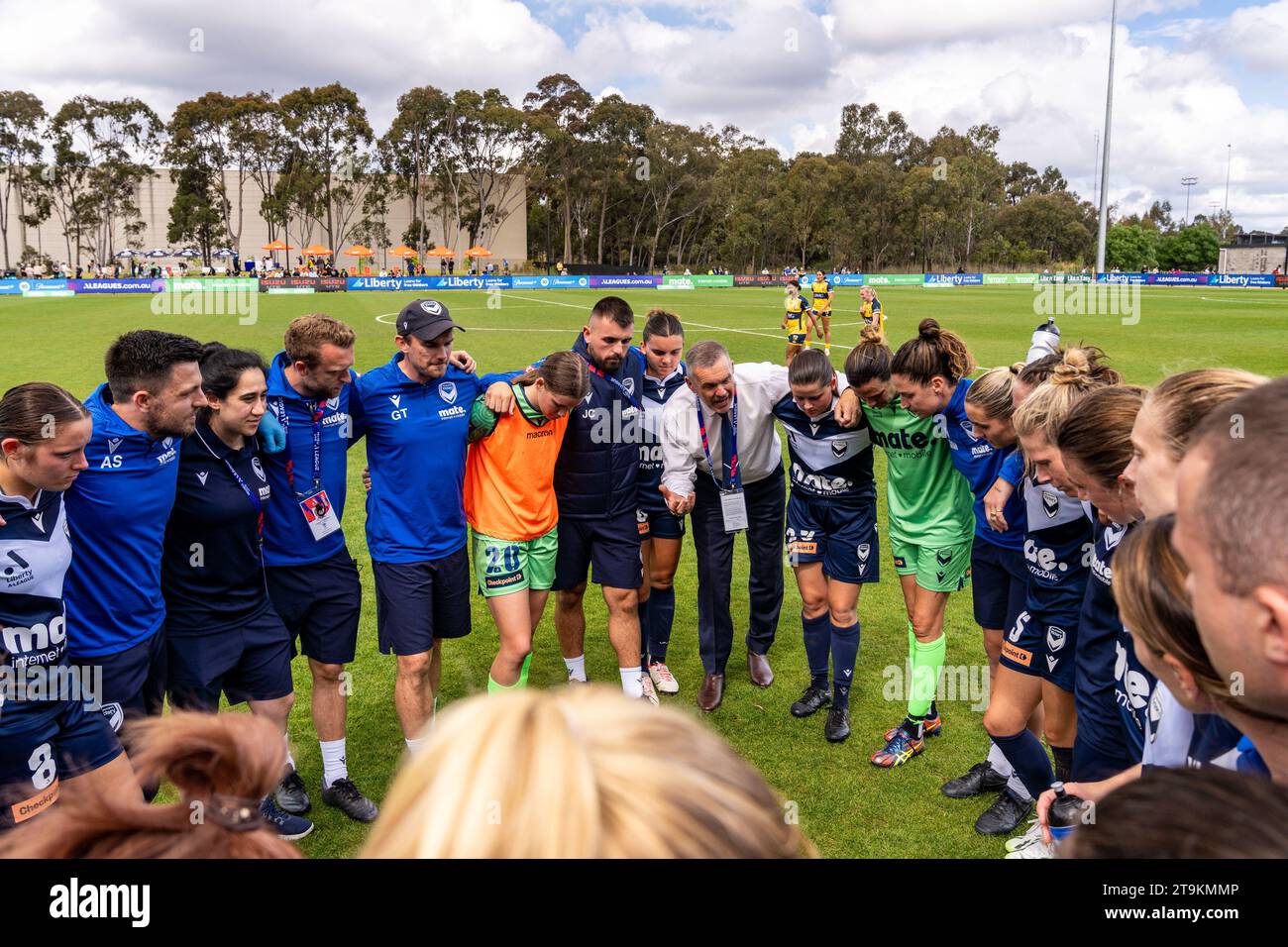 Bundoora, Australia. 26 November, 2023. Melbourne Victory FC Head Coach Jeff Hopkins talks with all of his players after winning the game in the dying minutes. Credit: James Forrester/Alamy Live News Stock Photo