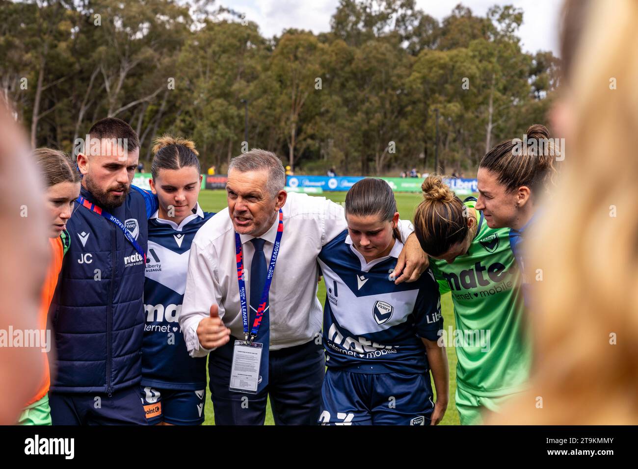 Bundoora, Australia. 26 November, 2023. Melbourne Victory FC Head Coach Jeff Hopkins celebrates the win with his players after clinching the victory in the final few minutes of play. Credit: James Forrester/Alamy Live News Stock Photo
