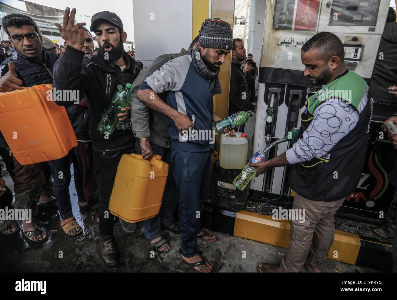 Rafah, Palestinian Territories. 26th Nov, 2023. A gas station worker