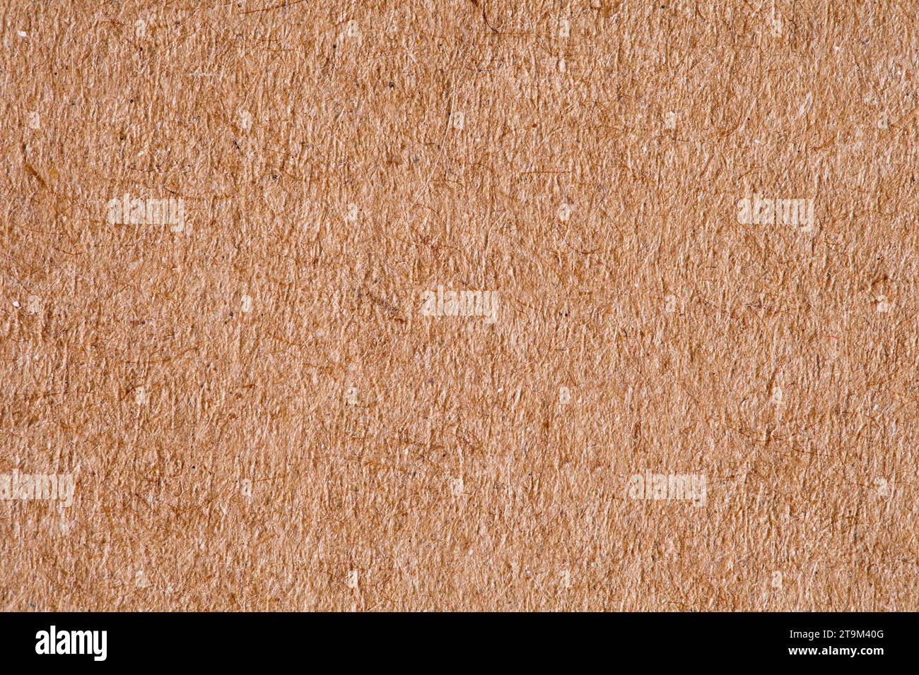 Paper is rough old orange, background structure, close-up macro view Stock Photo