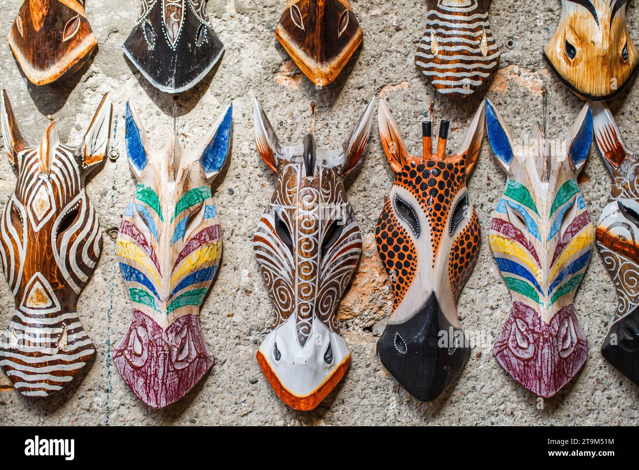 Masks of horse giraffe zebra multi-colored pagan souvenir, hanging on ...