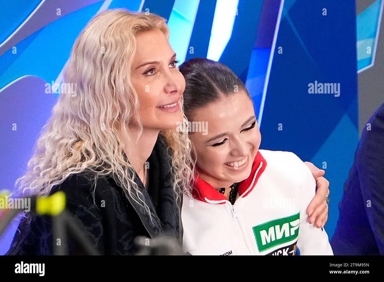 Russian Kamila Valieva, center, and her coach Eteri Tutberidze, left, react  after competing in the women's free skate program during the figure skating  competition at the 2023 Russian Figure Skating Grand Prix,