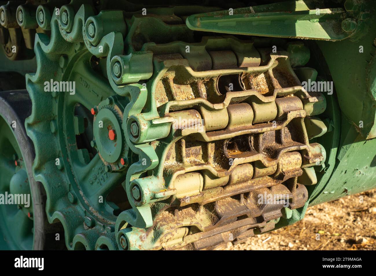Old tank with green painted tracks Stock Photo