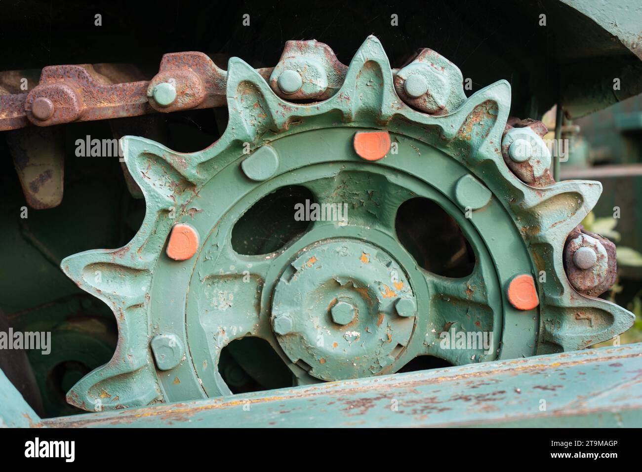 Old tank with green painted tracks Stock Photo