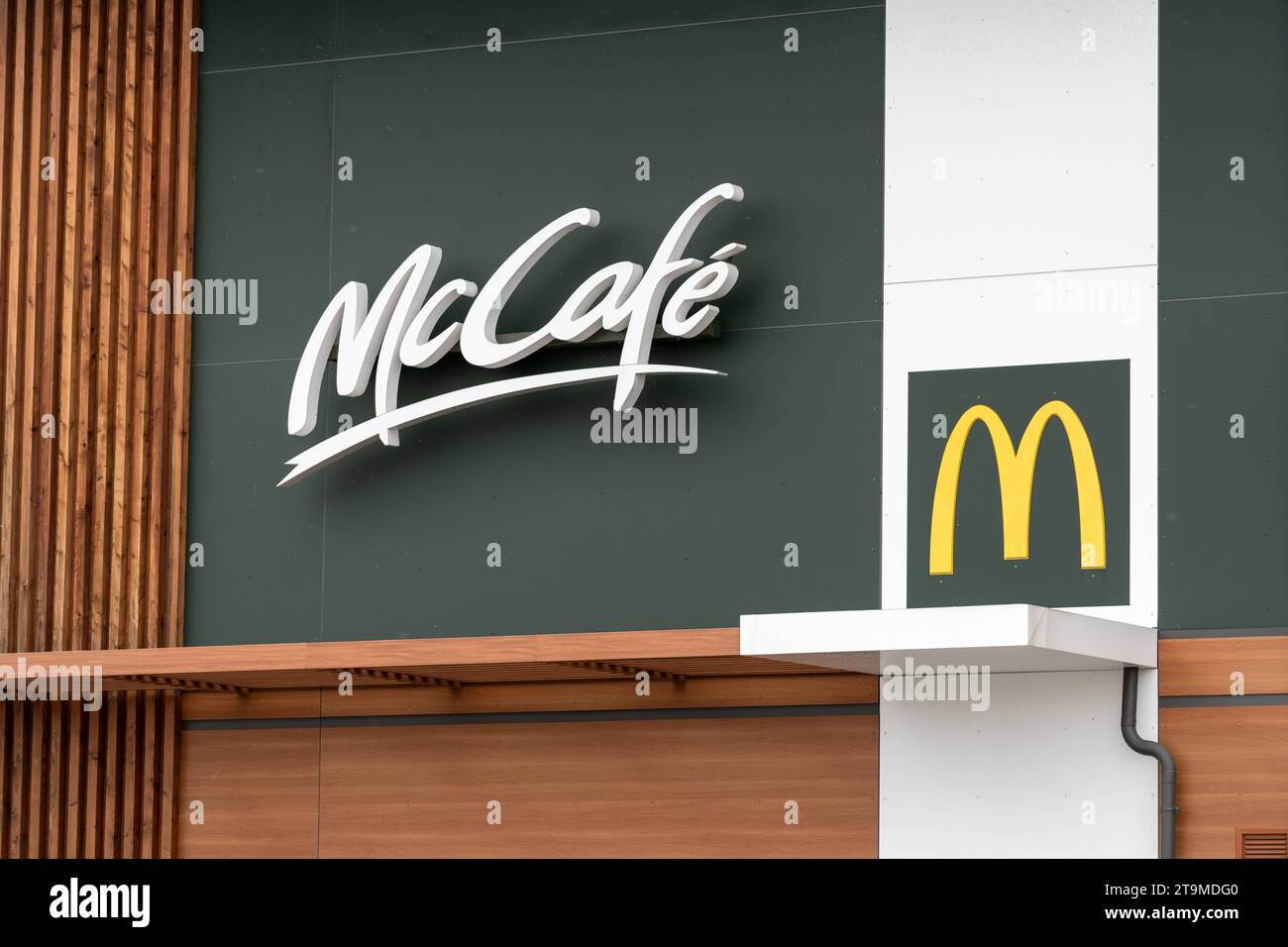 Parsdorf, Bavaria, Germany - November 26, 2023: McDonald s fast food and burger restaurant logo. McCafe symbol *** Mc Donalds Fastfood und Burger Restaurant Logo. McCafe Symbol Credit: Imago/Alamy Live News Stock Photo